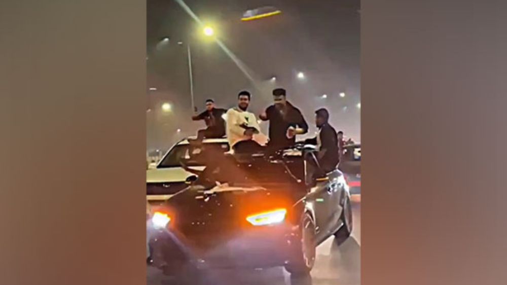 Viral video shows persons standing on roof of moving car