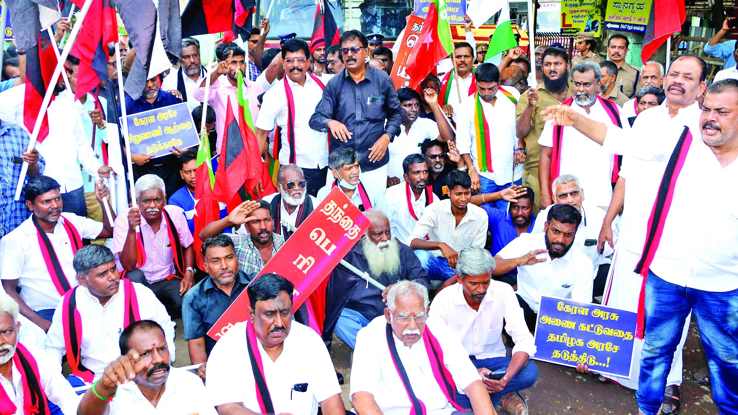 Protesting check dams across Siruvani, TPDK block Kerala buses