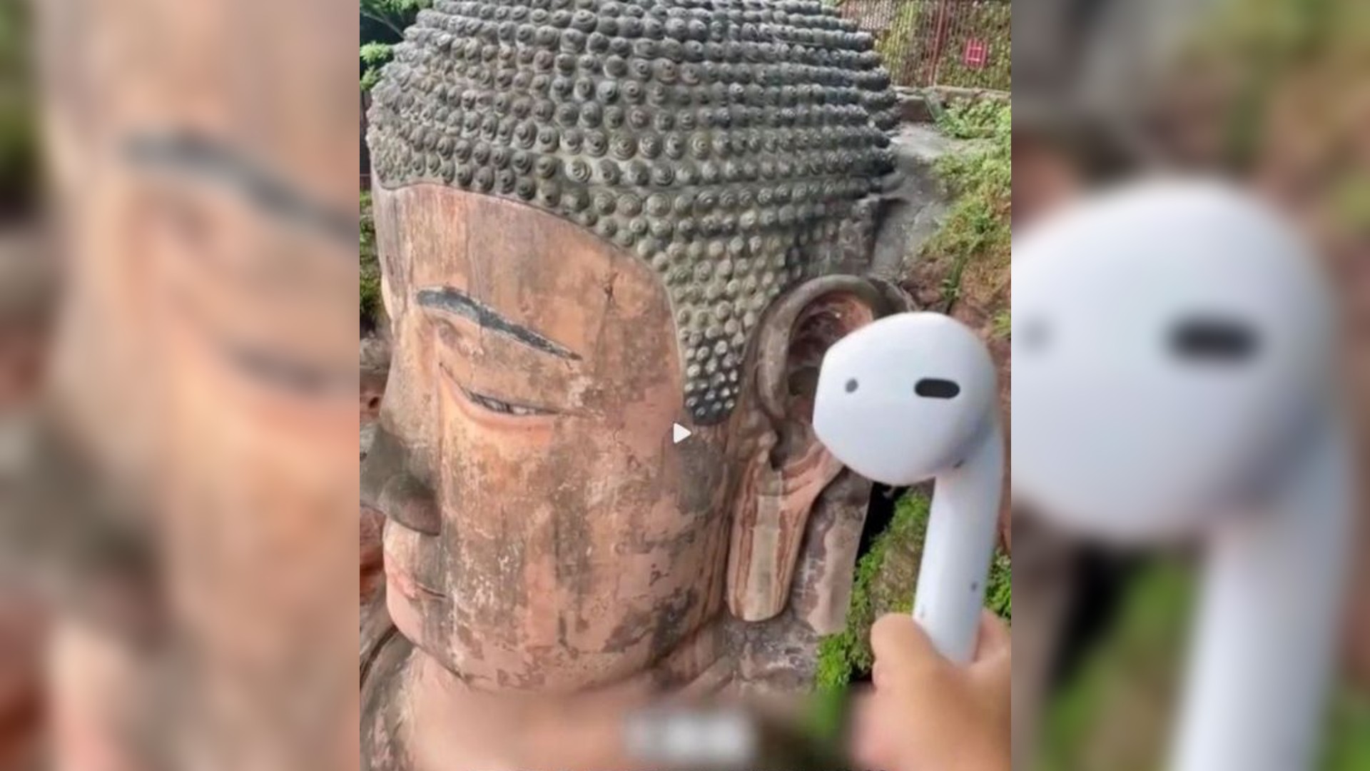 Viral: Man holds Airpod on Buddha statues ear to express his desires Viral: Man holds Airpod on Buddha statues ear to express his desires