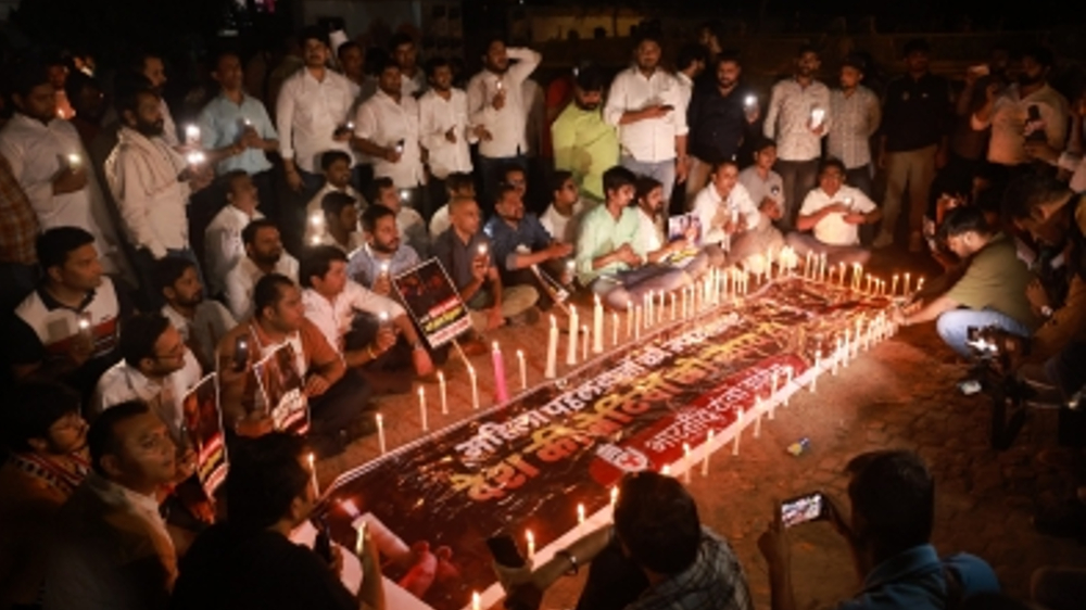 IYC holds candle-light march in support of protesting wrestlers IYC holds candle-light march in support of protesting wrestlers