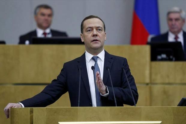 Russian PM says backs criminalising observance of US sanctions