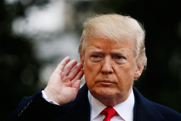US President Donald Trump suggests armed deputy at Florida school was a coward