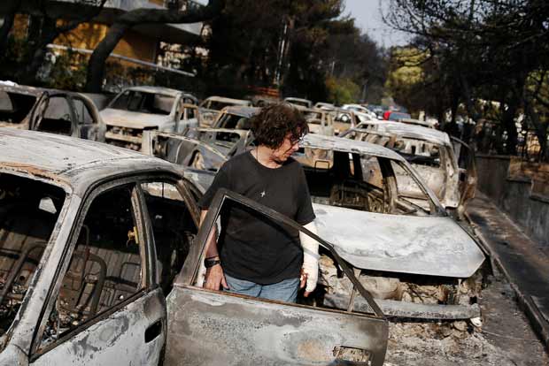 Wildfires kill at least 74 near Athens, families embrace as flames close in