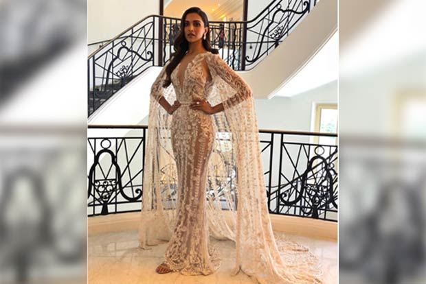 Deepika looks angelic in white caped gown at Cannes