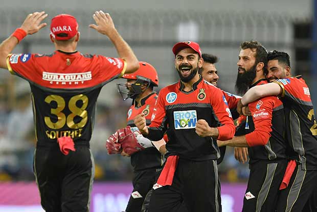 Dominant RCB thrash Kings XI by 10 wickets to live another day