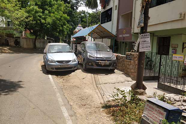 Footpaths double up as parking lots in Postal Colony, push out pedestrians
