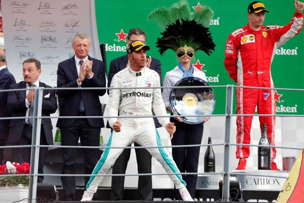 Hamilton wins as Vettel spins in Ferraris backyard