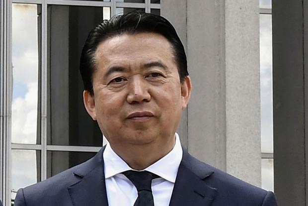 China formally arrests Interpols former chief for corruption