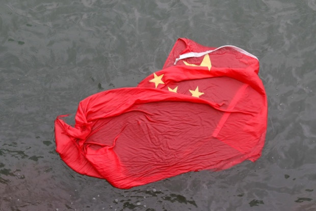 Hong Kong protesters throw Chinese flag into iconic harbour