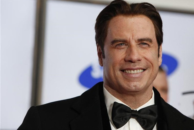 John Travolta ditches bald look for Grease screening