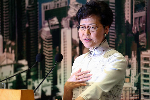 Hong Kong leader apologises as protesters press demands for her to quit