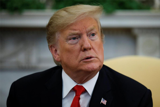 Trump delays decision on auto tariffs for up to six months