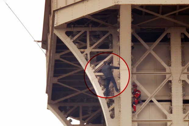 Eiffel Tower evacuated after climber scales monument