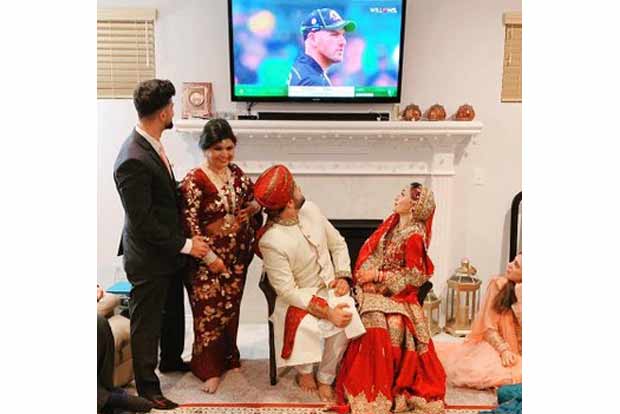 Couple watch Aus-Pak T20I soon after wedding, image goes viral Couple watch Aus-Pak T20I soon after wedding, image goes viral