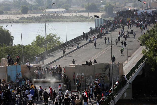 Protesters retake part of bridge in central Baghdad