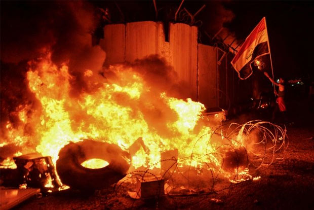 Iraqi forces kill 14 protesters after Iranian consulate torched