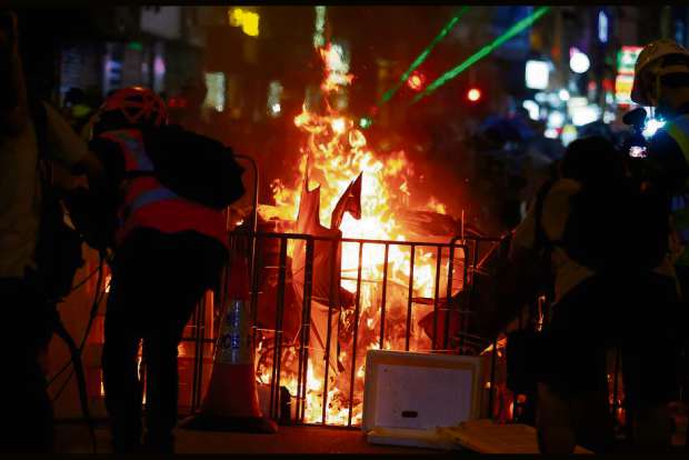 Hong Kong police fend off airport protest but tear gas fired again in Kowloon