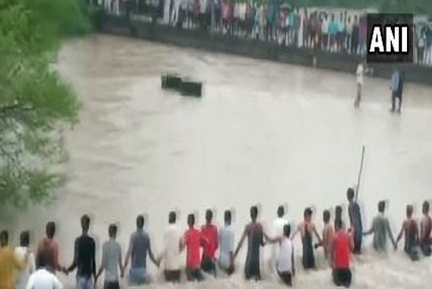 Villagers form human chain to save man who was washed away
