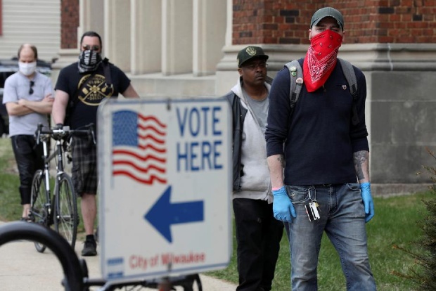 Long lines and frustration as Wisconsinites vote during coronavirus pandemic