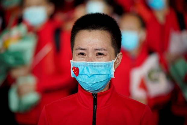 Chinas Wuhan ends its coronavirus lockdown but elsewhere one begins