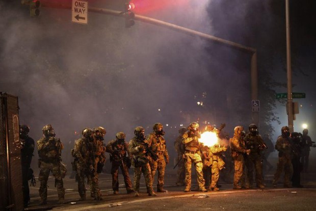 Portland police declare riot, push protesters from building