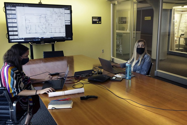 Ergonomics for a crisis: Taller cubicles, one-way aisles - Office workers to adjust