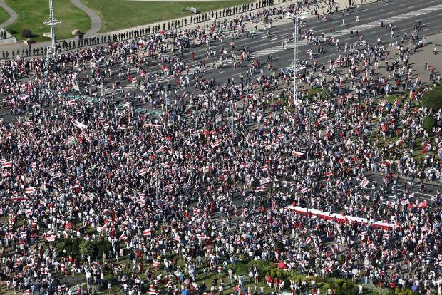 Protesters crowd Minsk as Belarus leader gets birthday call from Putin