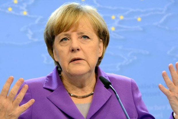 Merkel slams poison of racism after nine killed in Germany shootings