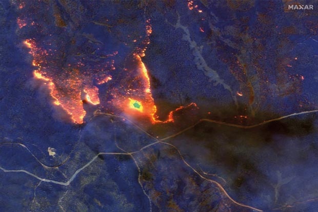 Australian bushfires ease on cooler weather, death toll rises