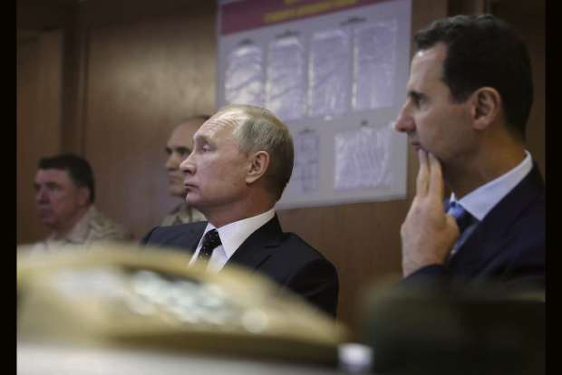 Putin pays surprise visit to Syria, meets Assad