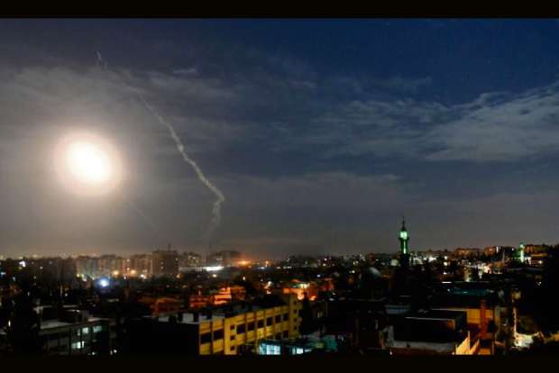 Syria says its air defences intercept attack on airbase