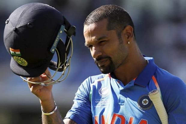 Dhawan hurts left shoulder, walks off field