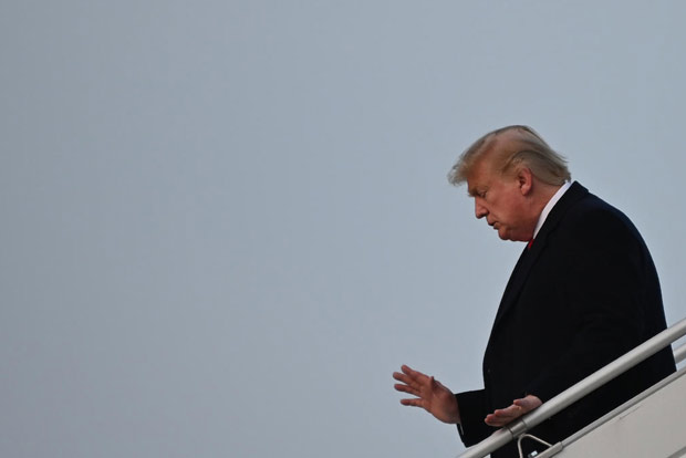 Trump arrives in Davos hours before impeachment trial reopens