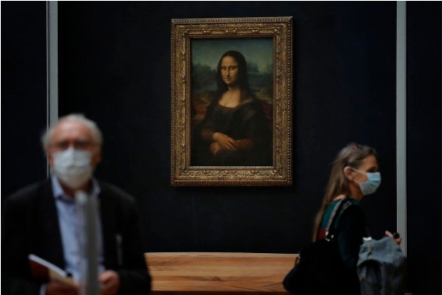 Mona Lisa back at work, visitors limited, as Louvre reopens