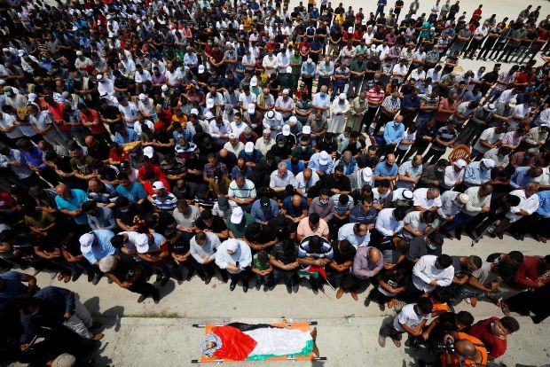 Hundreds gather for funeral of Palestinian shot by Israeli troops