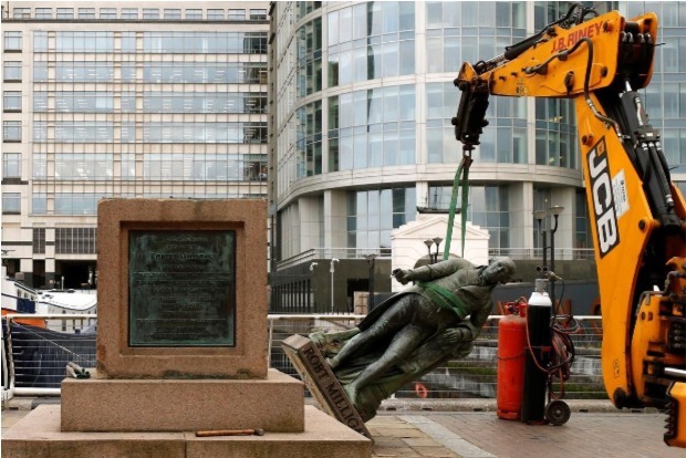 Confronting a bygone era, London removes slave trader statue