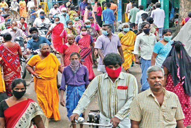 Social distancing fails as people queue for Rs 1,000