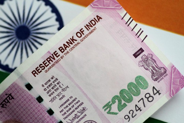 Rupee settles flat at 75.65 against US dollar