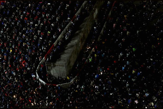 Bags packed, Malaysians stream into Singapore ahead of coronavirus travel ban