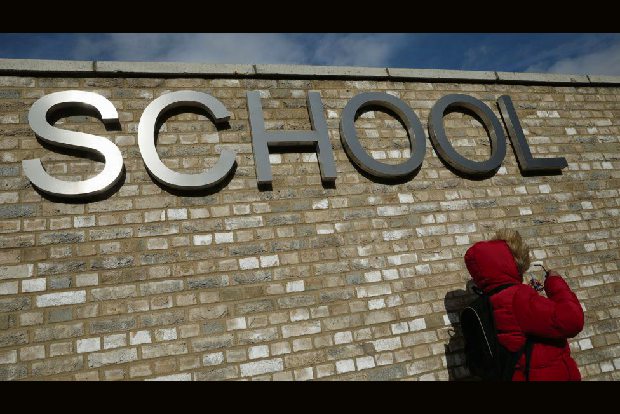 UK shuts down schools, cancels exams in coronavirus lockdown