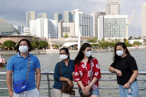Singapore reports 52 new coronavirus cases