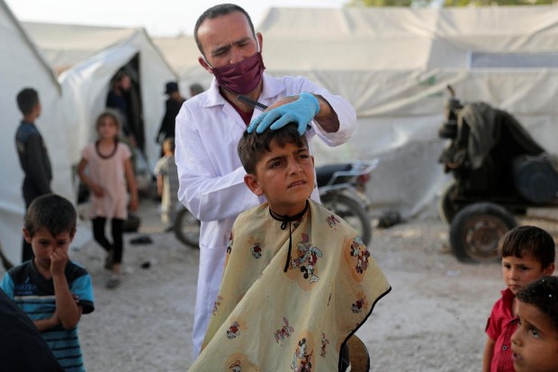 In Syrias war-torn Idlib, travelling barbers bring children relief