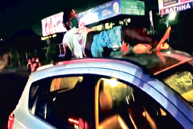 Accident victim lands on roof of car, travels 2 km before police rescue him