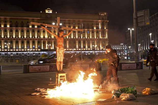 Russian held after crucifixion stunt near security agency HQ