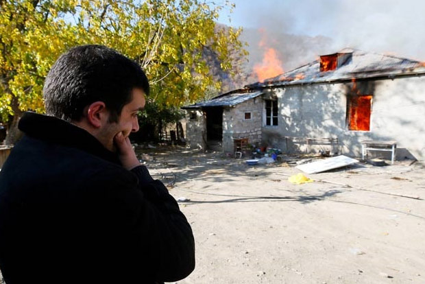 Armenians torch their homes on land ceded to Azerbaijan Armenians torch their homes on land ceded to Azerbaijan