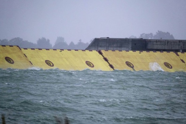 Venice deploys flood barrier for first time as storm drives up tide