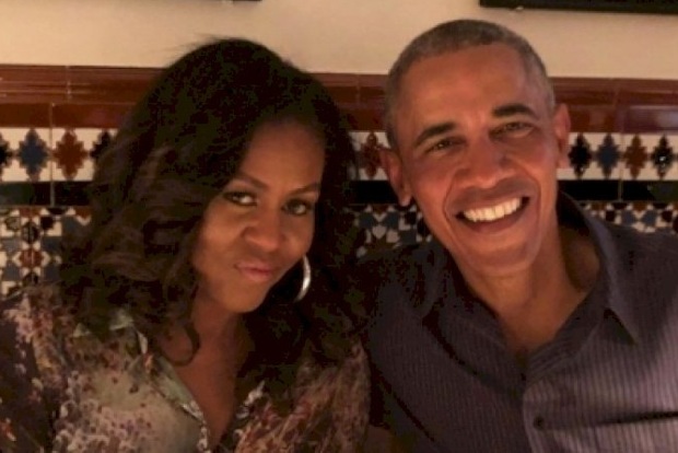 On 28th wedding anniversary, Obamas urge people to vote