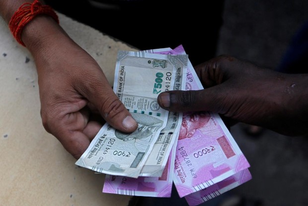 Rupee slips 8 paise to 73.21 against US dollar in early trade Rupee slips 8 paise to 73.21 against US dollar in early trade