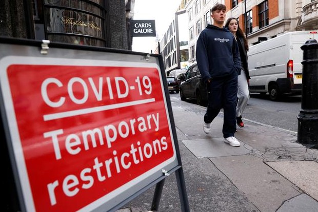 New virus restrictions in Europe, Merkel warns of hard days