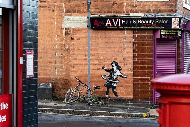 Celebrated graffiti artist Banksy confirms UK hula-hooping girl mural is his work